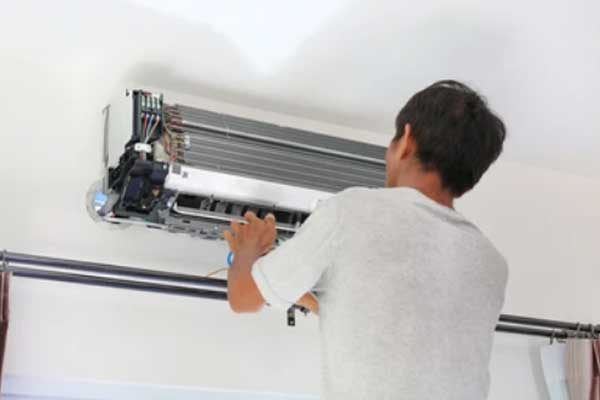 Engineer fitting aircon